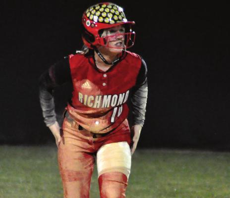 SENIOR KAYDEN BOWMAN gets some of the dirt off of her uniform and stands ready to run at second base during Richmond’s Class 3 District 7 meeting with Oak Grove Tuesday at Odessa. SHAWN RONEY | Staff