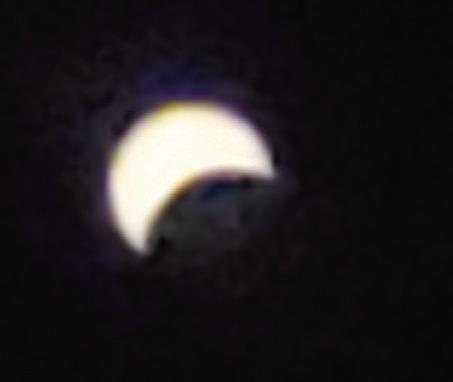 Orrick students watch the moon cover the sun during eclipse