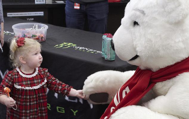 FIONA GOOD shakes hands with the Polar Bear at Harps. SHARON DONAT | Staff