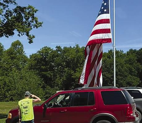 WITH A SALUTE, the American flag is flown for Flag Day. JOSHUA BRUNGARDT | Staff