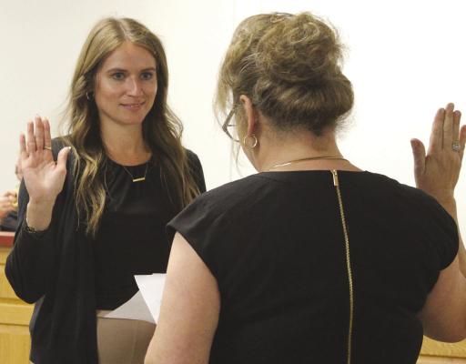 NEW RICHMOND CITY CLERK Saige Mason (left) is sworn in by City Administrator Tonya William. SHARON DONAT | Staff