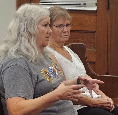 SANDRA HENDRIX AUSTIN (left) and Jane Weisz ask the Ray County Commission for permission to open the courthouse lawn time capsule ahead of the Richmond High School Class of 1976’s upcoming 50-year reunion. MIRANDA JAMISON | Staff
