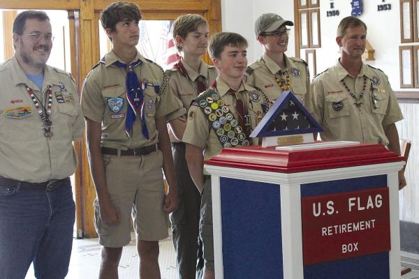 BOY SCOUT TROOP 324 supports Jasper Gay at presentation of the flag retirement box to the Ray County Commission. SHARON DONAT | Staff