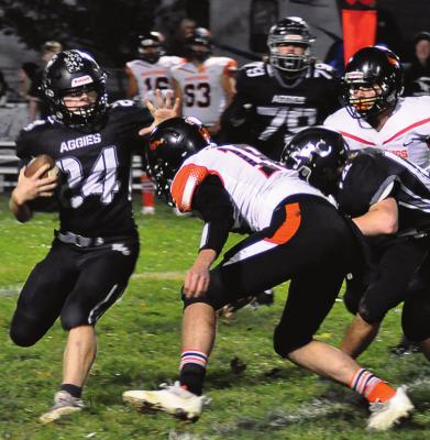 KELTON GORDON, a Hardin-Central junior, gets the call to carry for the Aggies during Norborne Hardin-Central’s 64-30 loss to Northwest of Hughesville/Sacred Heart of Sedalia Oct. 15 at Hardin-Central. The Aggies rely on Gordon to help run the football during their 42-18 season-ending loss to Northwest/Sacred Heart Nov. 5 at Hughesville, too. SHAWN RONEY | Staff