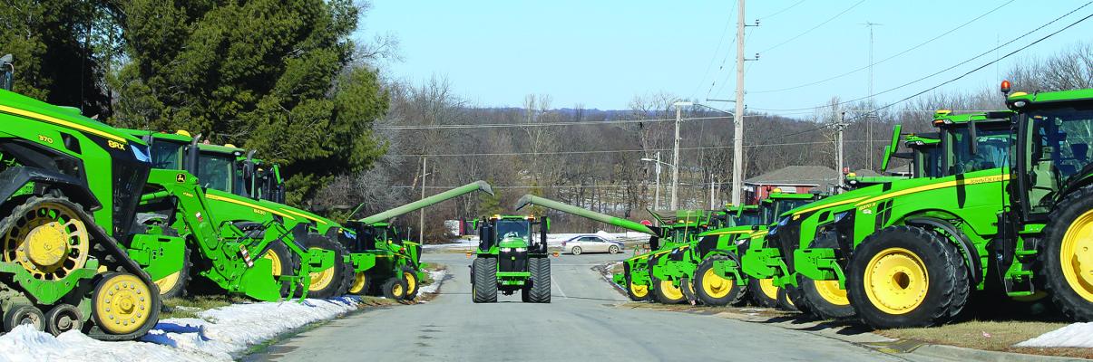 A FINAL TRIBUTE – Local farmers line the funeral procession route, flashing their tractor lights in a solemn farewell to Steve Hamm. A pillar of the agricultural community, Hamm’s dedication and kindness left an indelible mark not only on local farming but on the hearts of all who knew him. SHARON DONAT | Staff