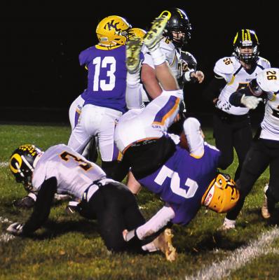 ON THE GROUND, Orrick junior Zander Stevinson upends Wildkats quarterback Landon Wells during the first half. When the scoreboard clock reaches zero after the final quarter, however, it is King City/Union Star upending Orrick 78-6 in District 3 8-man football action Nov. 12 at King City. SHAWN RONEY | Staff