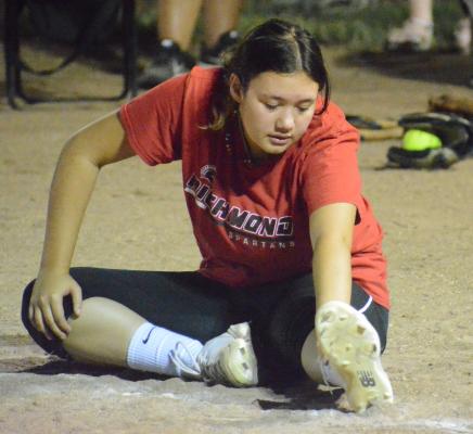 SOPHOMORE ALEANA McFEE stretches on Aug. 8 at Southview Park in Richmond to help prepare herself to pitch this varsity softball season for the Spartans, who are slated to open this weekend in tournament play at Cameron. SHAWN RONEY | Staff