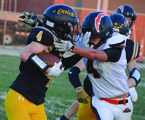 LEVI FIELDER (left) uses a stiff arm move to fight for yards during the Bearcats’ homecoming victory. SHAWN RONEY | Staff