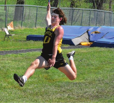 SOPHOMORE Jaxon Miller attempts the long jump May 7 late in the Class 1 District 6 track and field championships on the Midway School District campus in Cleveland. He qualifies for sectional competition this weekend. SHAWN RONEY | Staff