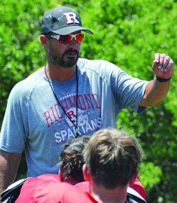RICHMOND FOOTBALL COACH Nick Persell talks to his players to cap a team camp session. SHAWN RONEY | Staff