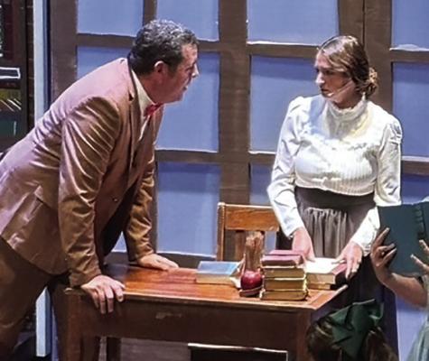 RYAN KUGLER (left) as Professor Harold Hill, speaks with Danielle Greene portraying the librarian, Marian Paroo.