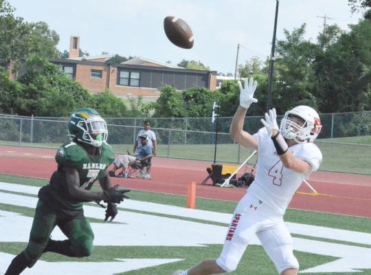 COME TO PAPA: Spartans wide receiver Eli Steele watches a second-quarter TD pass from Donivin Williams float into his hands during Richmond’s 61-26 win over New Madrid County Central Aug. 26 at Ste. Genevieve High School.