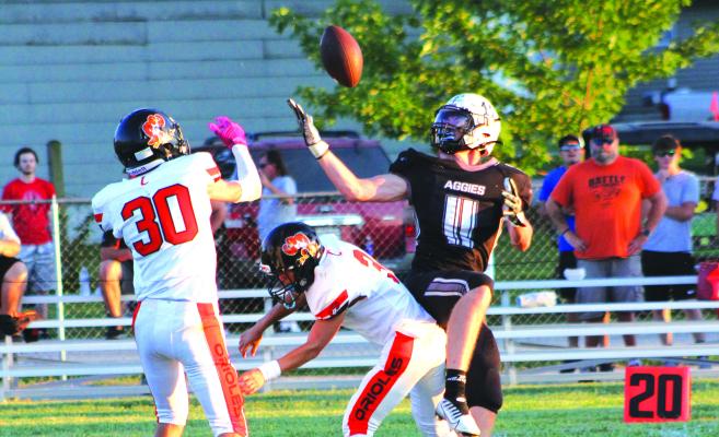 KOBE GIBSON, a Norborne senior, keeps his eyes on the football as he looks to haul in a first-half pass for Norborne Hardin-Central during the first half of the Aggies’ 70-28 rout of Concordia Sept. 2 at Hardin-Central. SOPHIA BALES | Staff
