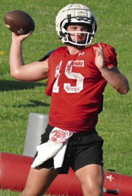 SHAWN RONEY | Staff QUARTERBACK JACOB LIEBERKNECHT sets to pass as Richmond begins its high school football camp sessions.