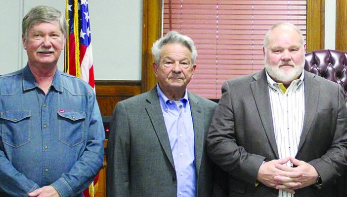 BOBBY DON DAVIES (from left), Max Hockemeier and Bart Willim are sworn into office on Dec. 31, 2024.
