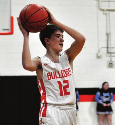 FRESHMAN DREW HAWKINS looks to pass Monday for Hardin-Central. SHAWN RONEY | Staff