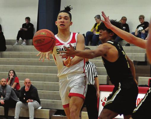 COMING OFF the bench, Donivin Williams passes during the first half of Richmond’s 77-21 win Monday over Trenton at Lawson in tournament play. SHAWN RONEY | Staff