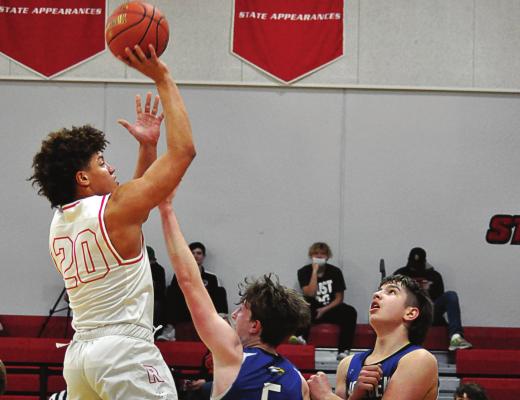 RICHMOND JUNIOR Keyshawn Elliott rises above Holden’s defense to attempt a short, one-handed jump shot. SHAWN RONEY | Staff