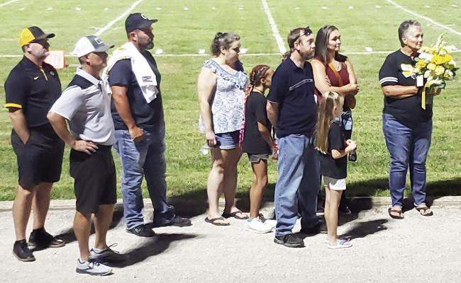 MEMBERS OF Ritchie Vick’s family participate in a halftime tribute to the late supporter of Orrick sports Sept. 2 at Simmons Field. NICOLE SCOTT | Staff