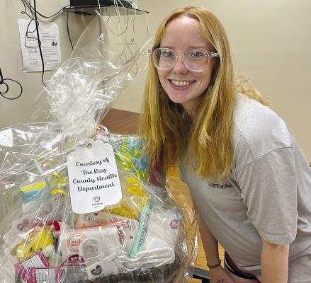 ALISHA MILLIGAN won a basket of baby goodies from the Richmond Bridge of Hope’s “Community Baby Shower” event. The shower was recently coordinated by Richmond’s Bridge of Hope Program and Executive Director Connie Taylor and held at Ray County Library’s Community Room. Pregnant mothers, those interested in pregnancy education, and community members had the opportunity to join in the event. SOPHIA BALES | Staff