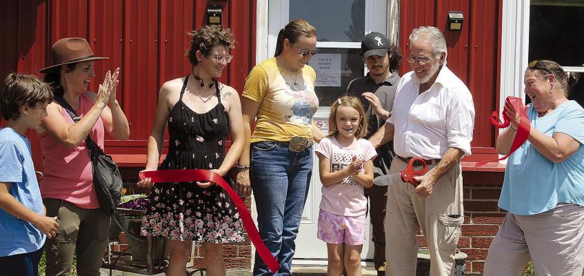 COMMUNITY MEMBERS CELEBRATE the official opening of Richmond Regenerative Agriculture’s donkey farm bed and breakfast, a working farm offering overnight accommodations and hands-on agricultural experiences. SHARON DONAT | Staff