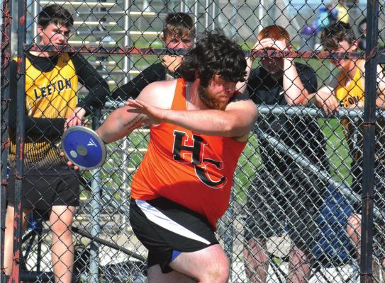 HARDIN-CENTRAL junior J.W. Doyle rotates as he attempts a discus throw May 7 during the Class 1 District 6 track and field championships on the Midway School District Campus in Cleveland. SHAWN RONEY | Staff
