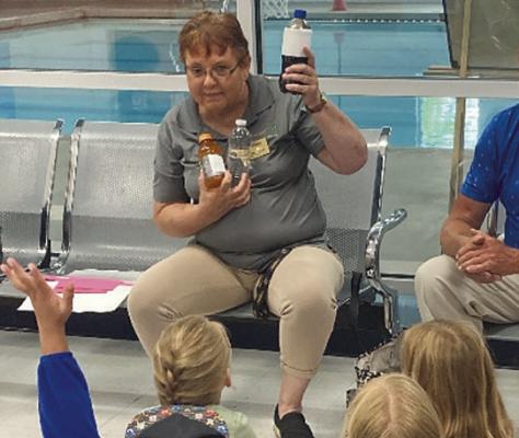 SUE ROBISON shows healthier drink options with her audience. Submitted