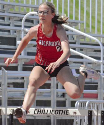 KAYLEE KING goes airborne as she heads down the home straightaway in the girls 300-meter low hurdles at the Class 3 District 8 meet. SHAWN RONEY | Staff