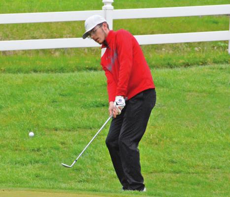 RICHMOND SENIOR Aiden Bowman chips the ball onto the green late in his round at the Richmond Invitational April 29 at Shirkey Golf Course in Richmond. Bowman cracks the top 20 out of a field 106 golfers. SHAWN RONEY | Staff