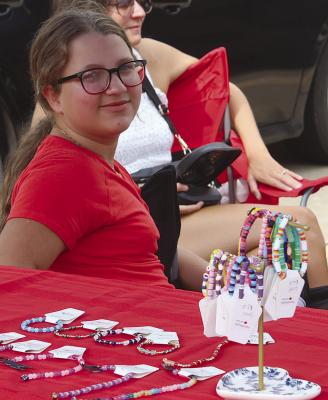 OAKLEIGH HOOK offers colorful bracelets and other jewelry at her Jeweled by Rose stand.