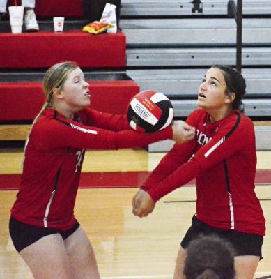SHAWN RONEY | Staff JUNIOR ALLISON COATS keeps the ball in play with a bump pass and senior teammate Sarah Brungardt is there to back her up Sept. 8 during Richmond’s varsity volleyball match with visiting Orrick.