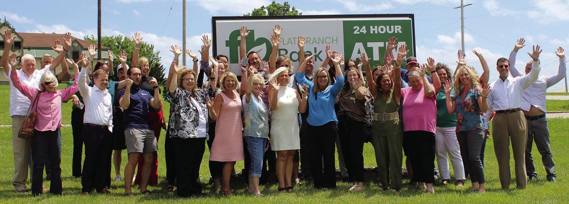 FLAT BRANCH BANK celebrates after the ribbon cutting hosted by the chamber. SHARON DONAT | Staff