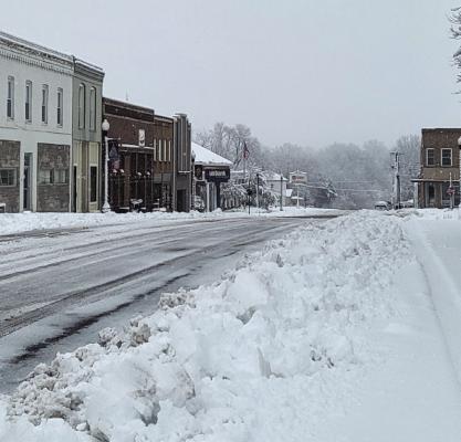NORTH MAIN STREET has been cleared, leaving parking areas piled with snow. SHARON DONAT | Staff