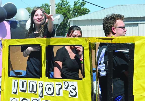 THE JUNIOR CLASS float travels the parade route school bus style.