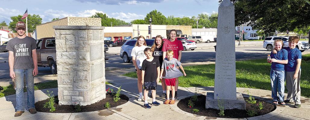 Olde Tyme 4-H members participate in planting flowers at the War Memorials in the Lawson City Park. Submitted