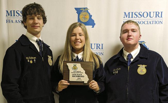 WILL ROBINSON (from left), Allison Coats and Sam Curtis receive an award for 14th place. Submitted