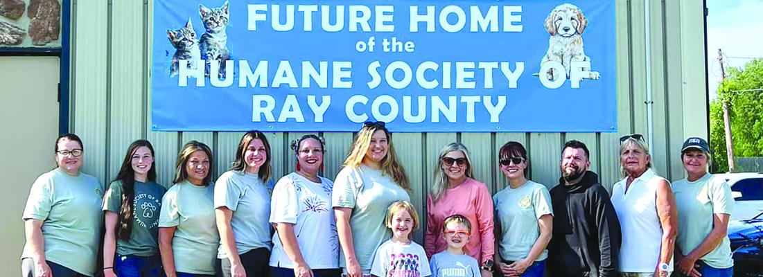 READY FOR A tour of the future location of the Humane Society are Yvette Plymell (back row, from left) Taylee Lyle, Glenda Carter, Atalie Blackwell, Heather Mattox, Maddy Hart, Jennifer Mills, Christi Cromer, Victor DeStefano, Clare Flamank and Amy Pearson, along with Gwendolyn (front row, from left) and Sterling Buck. Submitted