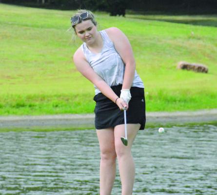 RICHMOND SENIOR Kennedy Wrisinger, hoping to return to state competition, attempts a chip shot as the Spartans practice Aug. 15 at Shirkey Golf Course. SHAWN RONEY | Staff