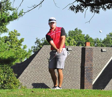 TIMMY HAMILTON of Richmond watches one of his chip shots during his Sept. AJGA qualifying round. SHAWN RONEY | Staff