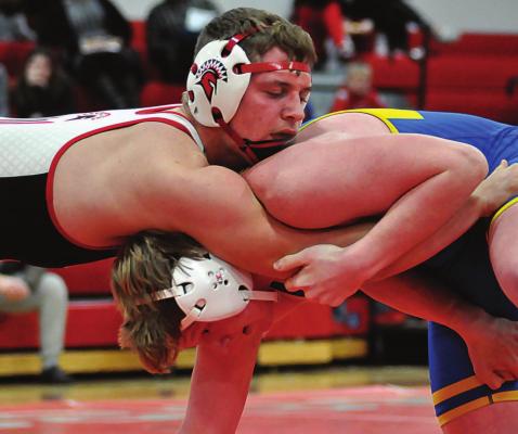 SHAWN RONEY | Staff AIDAN IVISON has the upper hand in his 182-pound match with Ty Ward during Richmond’s dual with St. Pius X of Kansas City on Jan. 13 at Richmond High School.