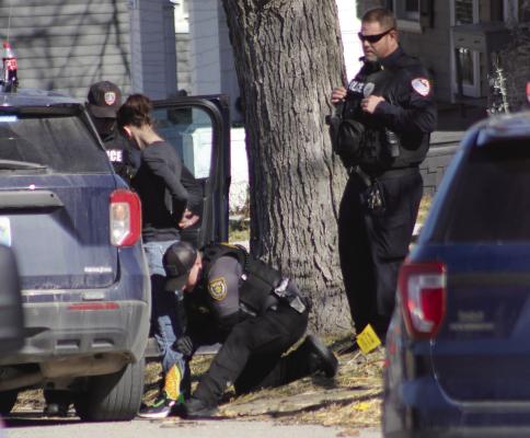 SOPHIA BALES | Staff JESSICA ARRINGTON is handcuffed and searched by Ray County Sheriff’s Deputy Kearia Railey.