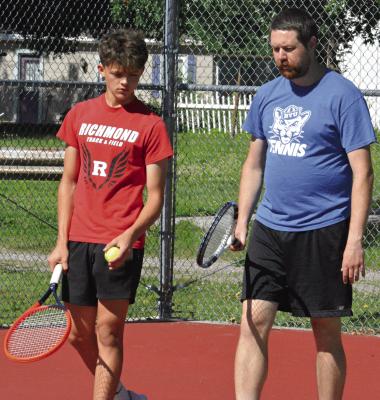 JAXON AHART (left) works on his game with Richmond Tennis Coach Zachary Baldauf. SHAWN RONEY | Staff