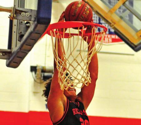 JUNIOR Keyshaun Elliott gets the ball above the rim for a first-half slam dunk Feb. 12 at Lexington. SHAWN RONEY | Staff
