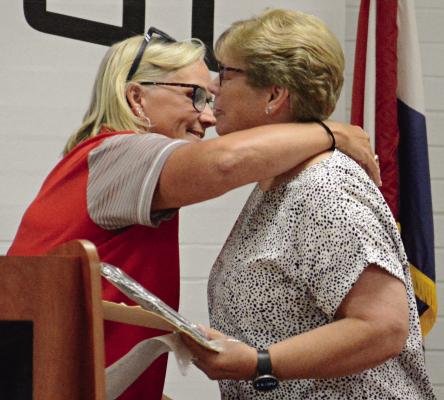 STACI MADDUX (left) embraces Miss Ethel Kirkpatrick Spartan Spirit Award recipient Jayanna Harrison. SHAWN RONEY | Staff