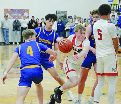 RICHMOND JUNIOR Nolan Quick (center) drives through the St. Pius X defense while teammate Brice Dome (right) sets a pick for him during Class 4 District 15 boys title game action. SHAWN RONEY | Staff