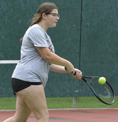 AVA BOZARTH hits a two-fisted backhand shot during one of Richmond’s offseason workouts. SHAWN RONEY | Staff