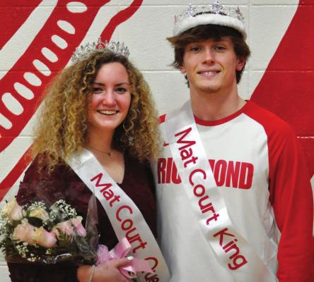 SOPHIA FARNAN and Wyatt Marshall sport their crowns and sashes for a Feb. 5 photo op after Richmond’s varsity court warming basketball games. SHAWN RONEY | Staff