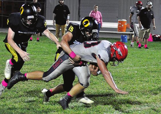 ORRICK freshman Jaxon Miller tackles Santa Fe running back Carter Woodrich to help the Bearcats win. SHAWN RONEY | Staff