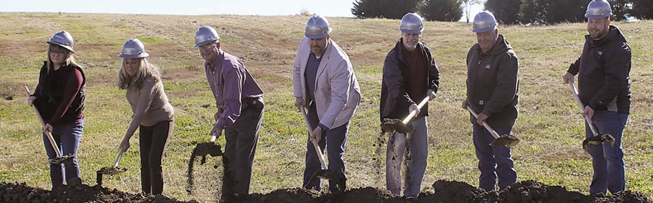 RAY COUNTY 911 Assistant Director Amanda Collins (from left), Director Kim Davis, Board Chairman Paul Harris, Board Treasurer Jimmy Carter, Board Member Pete Oulman, Board Member Perry Vandiver and Board Secretary Chad Burnine break ground on the new Ray County 911 Emergency Dispatch Center. MIRANDA JAMISON | Staff
