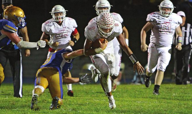 WHEN THE DEFENSE shuts down the passing game, Richmond quarterback Keyshaun Elliott runs. He picks up four TDs in the 54-34 win over Higginsville. J.C. VENTIMIGLIA | Staff